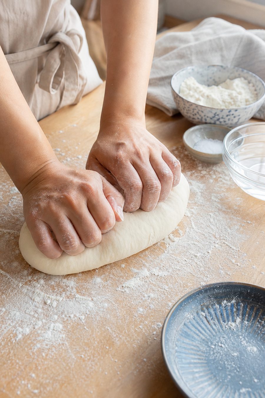 Kneading handmade udon dough with flour, salt, and water